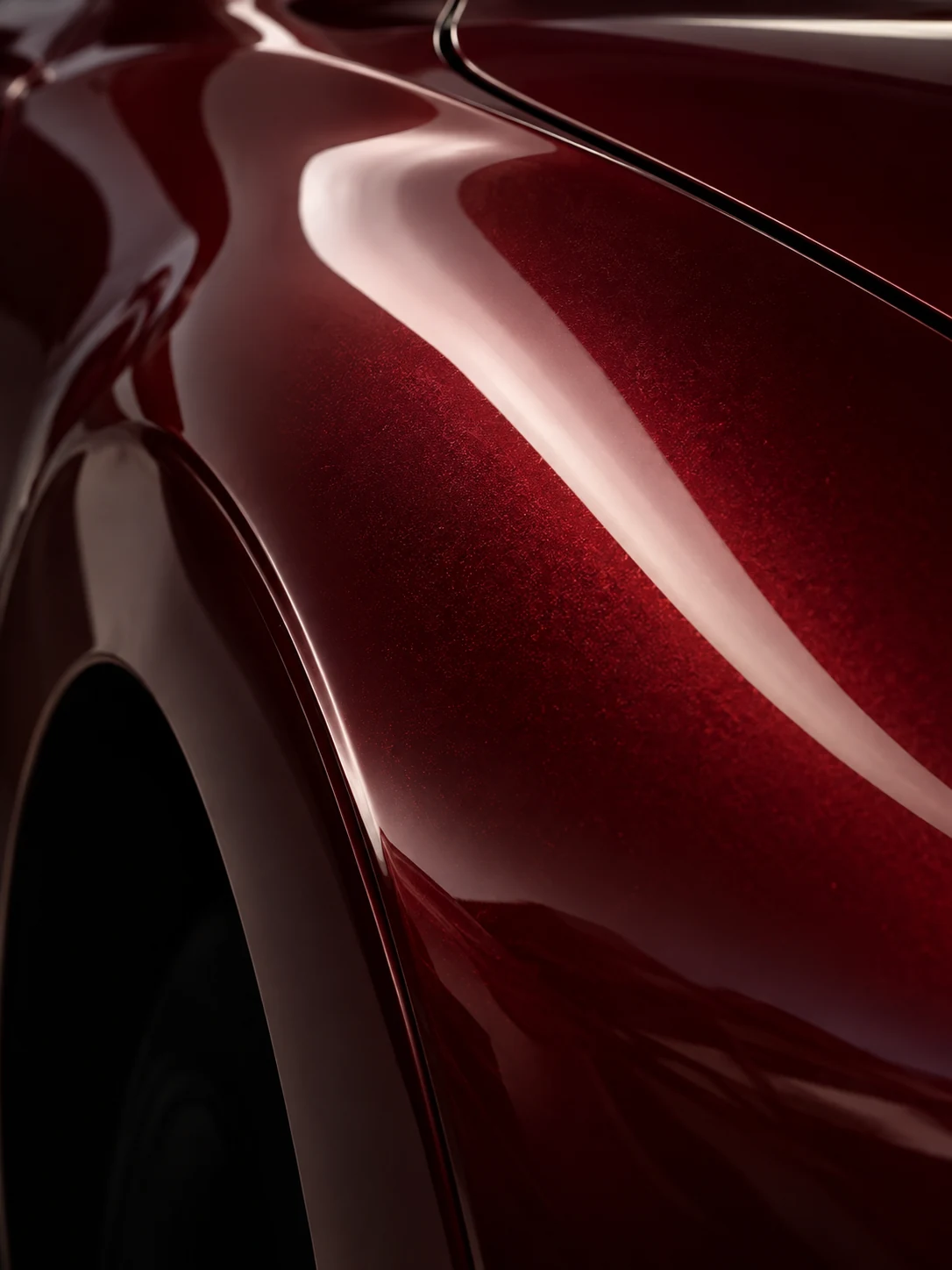 Peinture rouge profonde et reflets sur une sportive